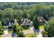 Aerial view of home and neighborhood with mature trees and manicured lawns at 1313 Fallsbrook Nw Ter, Acworth, GA 30101