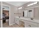 A bathroom featuring double sinks, a neutral color scheme, and a view into the bedroom at 1313 Fallsbrook Nw Ter, Acworth, GA 30101