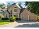 Charming two-story home with a two-car garage, bay window, and beautiful landscaping at 1313 Fallsbrook Nw Ter, Acworth, GA 30101