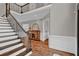 Grand foyer featuring hardwood floors, a staircase with iron railings, and elegant trim at 1313 Fallsbrook Nw Ter, Acworth, GA 30101