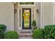 A welcoming front door has a beautiful wreath and lovely landscaping at 1313 Fallsbrook Nw Ter, Acworth, GA 30101
