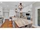 Modern kitchen with island, granite countertops, farm sink, and hardwood floors at 1313 Fallsbrook Nw Ter, Acworth, GA 30101
