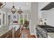 Spacious kitchen with stone countertops, white cabinets and modern stainless steel appliances at 1313 Fallsbrook Nw Ter, Acworth, GA 30101