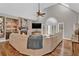 Cozy living room with a brick fireplace, vaulted ceiling, hardwood floors, and comfortable seating at 1313 Fallsbrook Nw Ter, Acworth, GA 30101