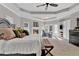 Spacious main bedroom suite featuring a fireplace, sitting area, and tray ceilings at 1313 Fallsbrook Nw Ter, Acworth, GA 30101