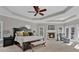 The bright main bedroom offers a fireplace and trey ceiling at 1313 Fallsbrook Nw Ter, Acworth, GA 30101