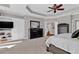 A view of the main bedroom with a ceiling fan, and a glimpse into a connecting area at 1313 Fallsbrook Nw Ter, Acworth, GA 30101