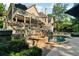 A swimming pool and a hot tub are nestled between the decks of a two-story home at 1313 Fallsbrook Nw Ter, Acworth, GA 30101