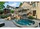 Gorgeous swimming pool and hot tub with lounge seating, perfect for relaxing in a private backyard setting at 1313 Fallsbrook Nw Ter, Acworth, GA 30101
