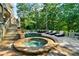 Inviting backyard with a swimming pool, a hot tub, lounge chairs, and an outdoor seating area at 1313 Fallsbrook Nw Ter, Acworth, GA 30101