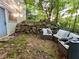 Backyard features a patio seating area surrounded by trees and greenery at 2268 Sparrow Ridge Ne Dr, Marietta, GA 30066