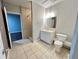 A simple bathroom includes a shower and vanity at 2268 Sparrow Ridge Ne Dr, Marietta, GA 30066