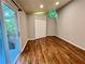 Bright bedroom with hardwood floors, closet, and sliding glass door to a deck at 2268 Sparrow Ridge Ne Dr, Marietta, GA 30066