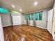 Large bedroom with hardwood floors, closet, and three windows at 2268 Sparrow Ridge Ne Dr, Marietta, GA 30066