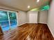 Bright bedroom with hardwood floors, closet, and sliding glass door to a deck at 2268 Sparrow Ridge Ne Dr, Marietta, GA 30066