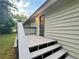 Exterior door to home with painted steps and deck and neutral colored siding at 2268 Sparrow Ridge Ne Dr, Marietta, GA 30066