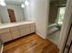 A well-lit bathroom with a modern vanity, lighting and large tub at 4968 Twin Branches Way, Dunwoody, GA 30338