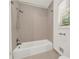 This bathroom features a neutral tile shower and updated fixtures at 4968 Twin Branches Way, Dunwoody, GA 30338