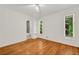 Bedroom with hardwood floors and bathroom access plus multiple windows at 4968 Twin Branches Way, Dunwoody, GA 30338
