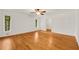 Spacious bedroom features hardwood floors, neutral paint, ceiling fan and large windows at 4968 Twin Branches Way, Dunwoody, GA 30338