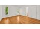 The room features hardwood floors, large windows, and access to a closet at 4968 Twin Branches Way, Dunwoody, GA 30338