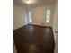 Cozy bedroom with pristine dark hardwood floors and bright windows for natural light at 4968 Twin Branches Way, Dunwoody, GA 30338