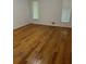 Cozy bedroom with hardwood floors and natural light from bright windows at 4968 Twin Branches Way, Dunwoody, GA 30338