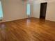 A bedroom featuring hardwood floors and a closet at 4968 Twin Branches Way, Dunwoody, GA 30338