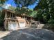 A two-story house with a fenced backyard and a two-car garage at 4968 Twin Branches Way, Dunwoody, GA 30338