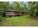 Expansive front yard and exterior view of this warm, inviting home at 4968 Twin Branches Way, Dunwoody, GA 30338