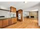 Open kitchen featuring a gas stove and views to Gathering room at 4968 Twin Branches Way, Dunwoody, GA 30338