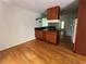 Efficient kitchen featuring wood cabinets, black counters and sleek hardware at 4968 Twin Branches Way, Dunwoody, GA 30338