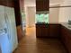 A spacious kitchen with stainless steel appliances and a window overlooking the backyard at 4968 Twin Branches Way, Dunwoody, GA 30338