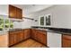 Kitchen with dark countertops and white appliances at 4968 Twin Branches Way, Dunwoody, GA 30338