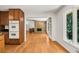 Kitchen with wood cabinets connecting to living room at 4968 Twin Branches Way, Dunwoody, GA 30338