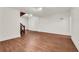 Open-concept living area with wood floors and neutral walls, offering a versatile space at 4968 Twin Branches Way, Dunwoody, GA 30338