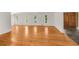 Hardwood floors in a bright, naturally lit living room with entry way at 4968 Twin Branches Way, Dunwoody, GA 30338