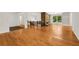 Open floor plan showcasing hardwood floors and a brick fireplace at 4968 Twin Branches Way, Dunwoody, GA 30338