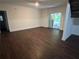 Spacious living room features hardwood floors and large sliding glass doors at 4968 Twin Branches Way, Dunwoody, GA 30338