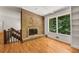 Living room featuring a fireplace and hardwood floors at 4968 Twin Branches Way, Dunwoody, GA 30338