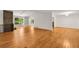 Bright living room featuring hardwood floors, a fireplace, and built-in shelving at 4968 Twin Branches Way, Dunwoody, GA 30338