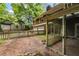 View of a brick patio with an enclosed back porch at 4968 Twin Branches Way, Dunwoody, GA 30338