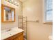 Bathroom features vanity, mirror, and storage shelving at 504 N Little Victoria Rd, Woodstock, GA 30189