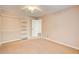 Bedroom featuring carpet flooring, ceiling fan, closet, and good natural light from window at 504 N Little Victoria Rd, Woodstock, GA 30189