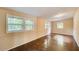 Sunlit bedroom featuring multiple windows and hardwood floors at 504 N Little Victoria Rd, Woodstock, GA 30189