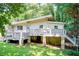 Charming single Gathering home featuring a spacious front deck perfect for outdoor entertaining at 504 N Little Victoria Rd, Woodstock, GA 30189