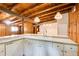 Kitchen features white cabinets, granite countertops, wood ceiling, and serving bar at 504 N Little Victoria Rd, Woodstock, GA 30189