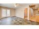 Open living room with French doors, ceiling fan, and tile flooring at 504 N Little Victoria Rd, Woodstock, GA 30189