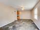 Living room featuring gray tile flooring, ceiling fan, and views to kitchen area at 504 N Little Victoria Rd, Woodstock, GA 30189