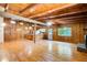 Open-concept living room and kitchen with wood-paneled walls and wood floors at 504 N Little Victoria Rd, Woodstock, GA 30189